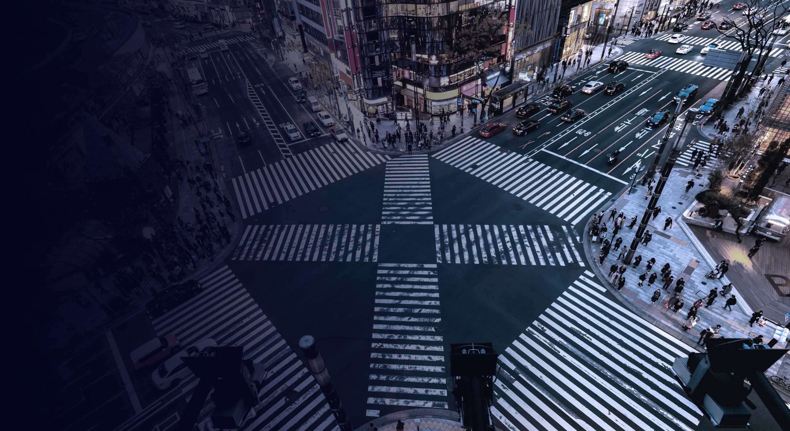 Aerial view of a busy city crossing at dusk